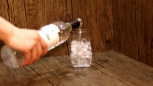 pour vodka into the glass